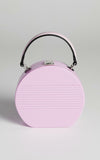 mini hard-shell bag is a fluro shade of lilac